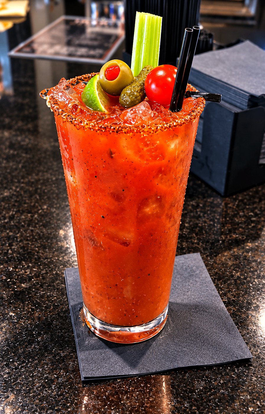 Bloody Mary with celery, olives and tomato